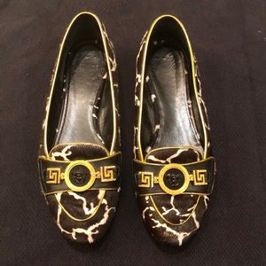 Black and gold Versace pony fur flats. Size 36